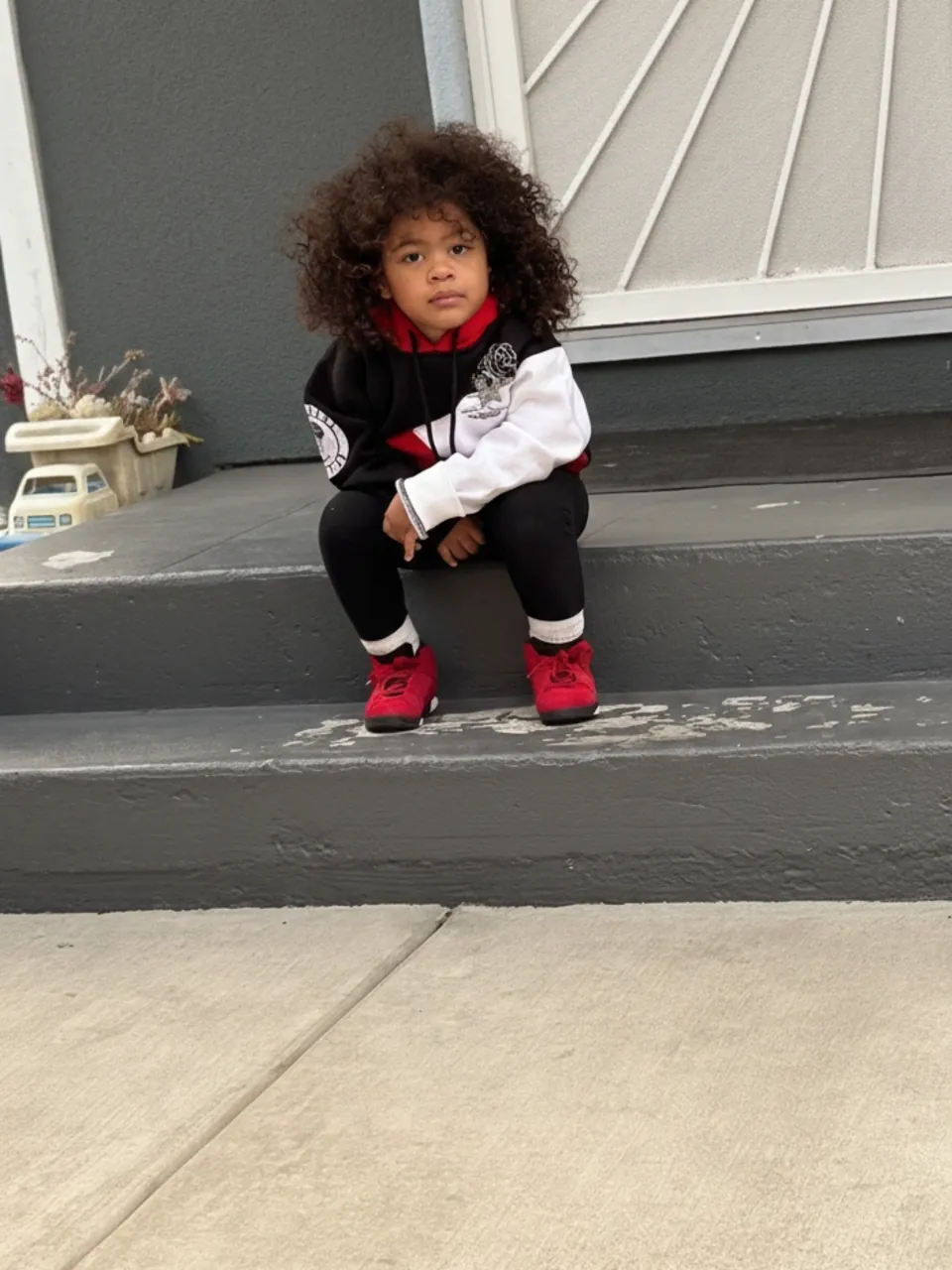 Kid in Black Rose hoodie